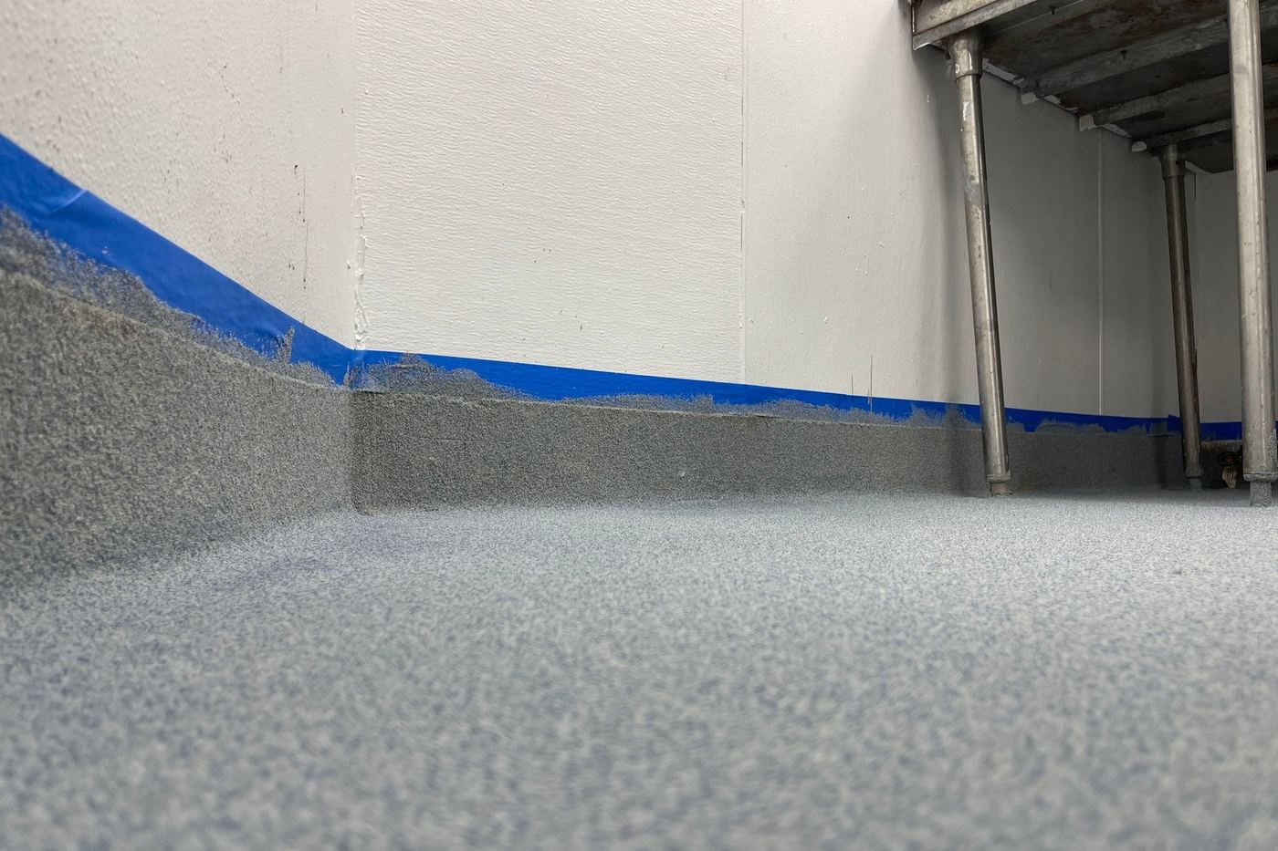 Example of a coated floor being installed