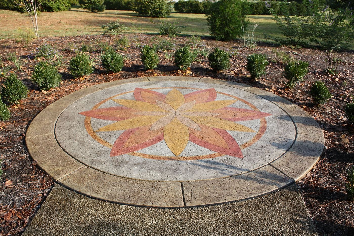 a decorative medallion set into an outdoor patio
